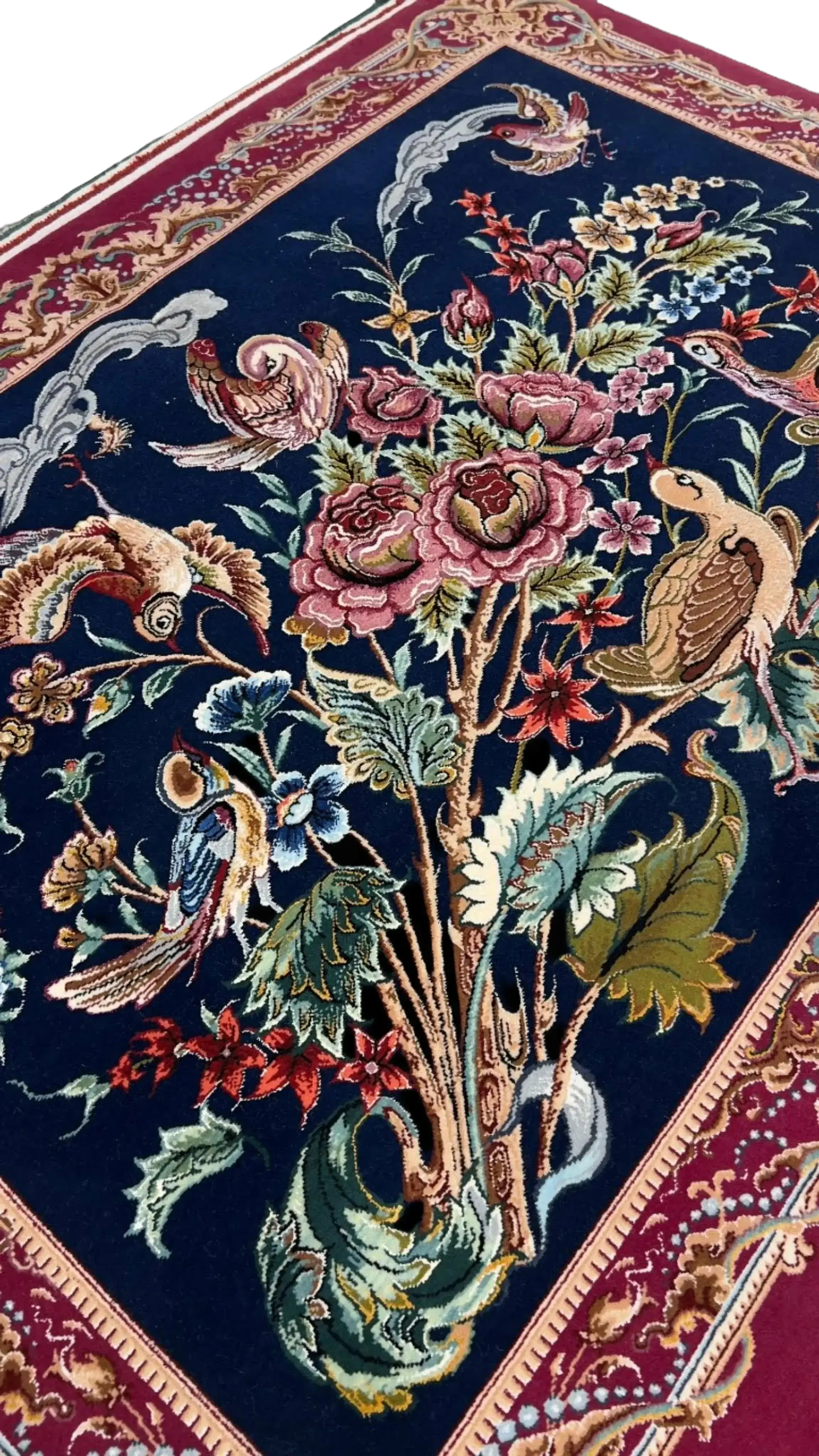 "Authentic Persian rug from Isfahan, Iran, crafted with wool and silk. This small area rug showcases detailed bird and floral patterns, ideal for collectors of Persian hand-knotted rugs."
